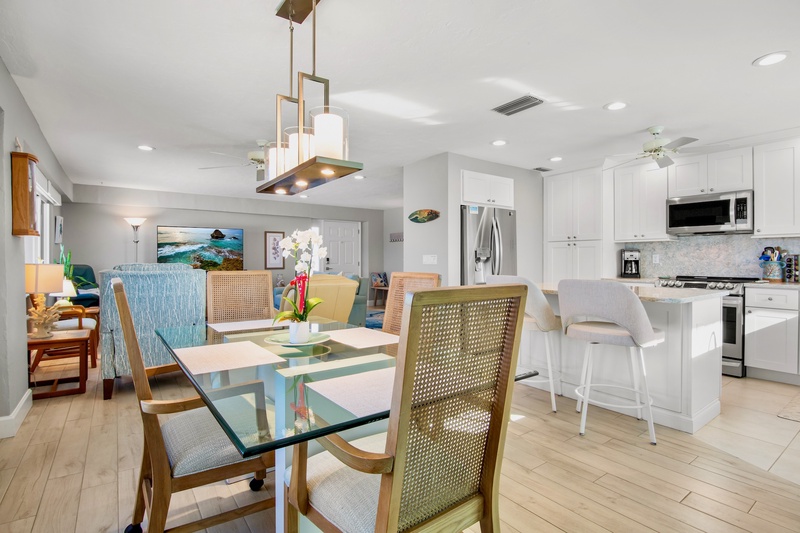 Your open-concept dining and kitchen space flows seamlessly, perfect for gathering with loved ones over home-cooked meals and morning coffee.