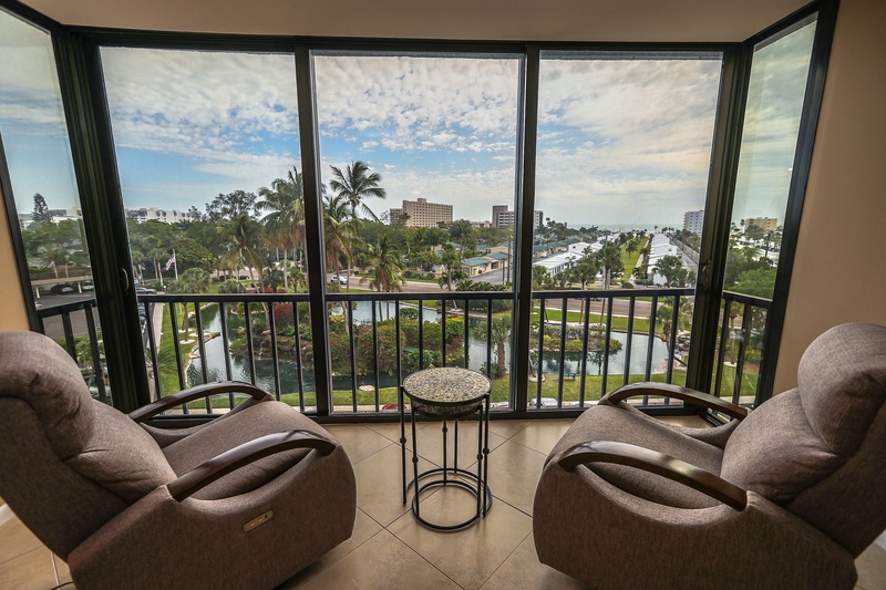 Relax in your private oasis with panoramic city and water views from floor-to-ceiling windows on your spacious balcony.