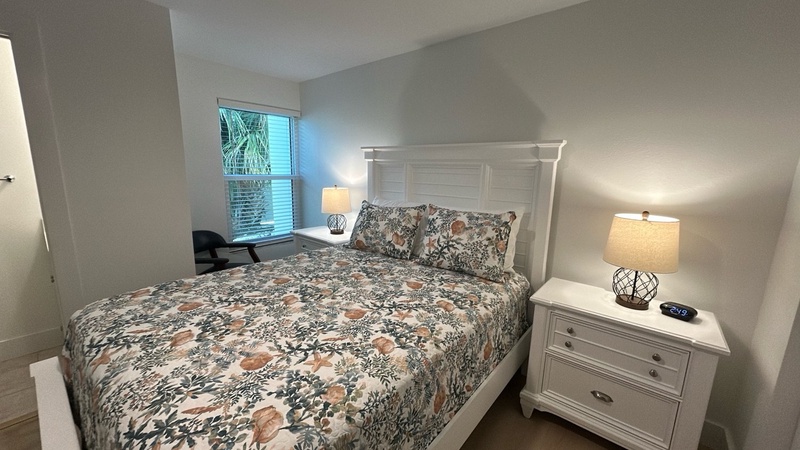 Drift off peacefully in your comfortable bedroom with soft linens, warm bedside lighting, and natural light streaming through your window.