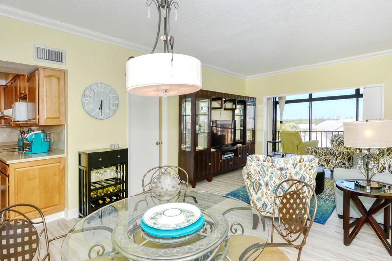 Your bright, airy living space features elegant furnishings, modern lighting, and seamless flow between dining and relaxation areas.