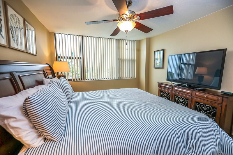 Unwind in your comfortable bedroom featuring crisp linens, natural light, and modern entertainment for peaceful evenings.