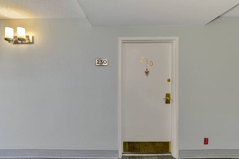 Arrive at your peaceful retreat in room 230, where warm lighting and clean hallways welcome you to your comfortable home away from home.