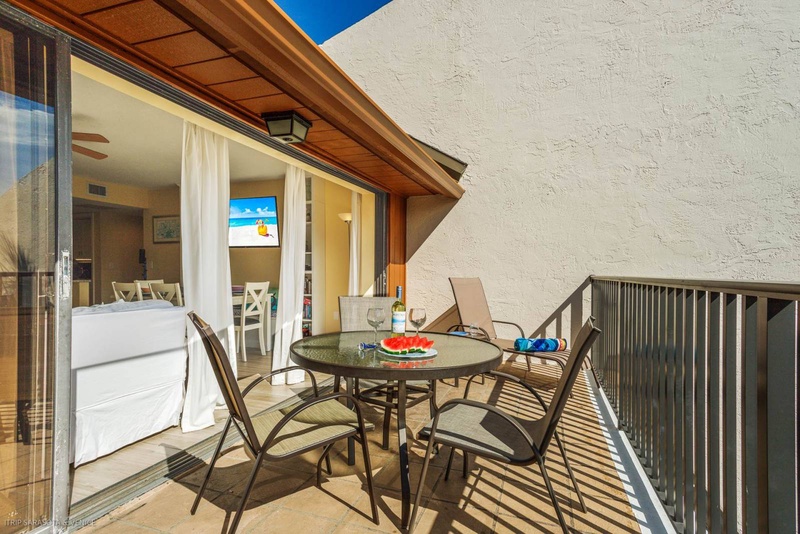 Enjoy your morning coffee on this sunny balcony with outdoor dining table, perfect for watching the world wake up.
