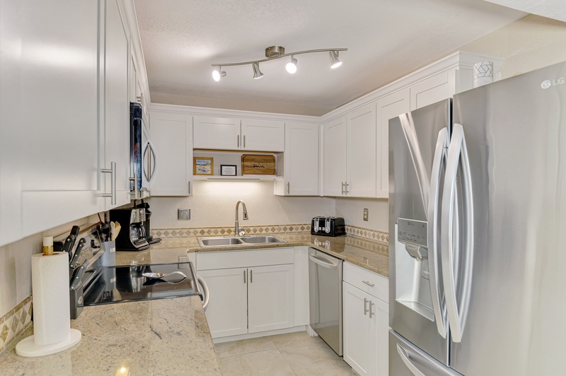 Your fully equipped kitchen features stainless steel appliances, granite countertops, and everything needed to prepare memorable meals during your stay.
