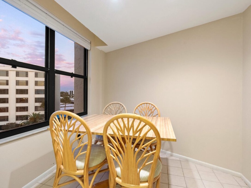 Gather around your private dining table with city views as twilight paints the sky in soft pastels.