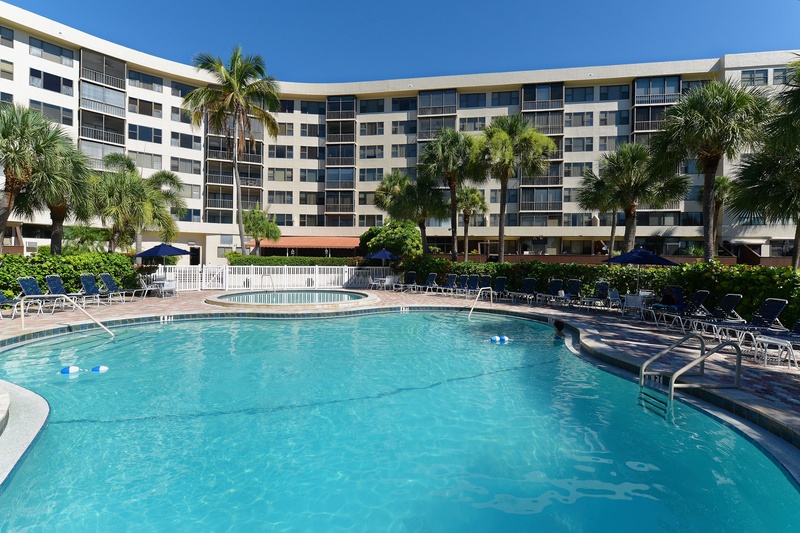 Take a refreshing dip in the crystal-clear pool surrounded by swaying palms and comfortable loungers for your ultimate relaxation.