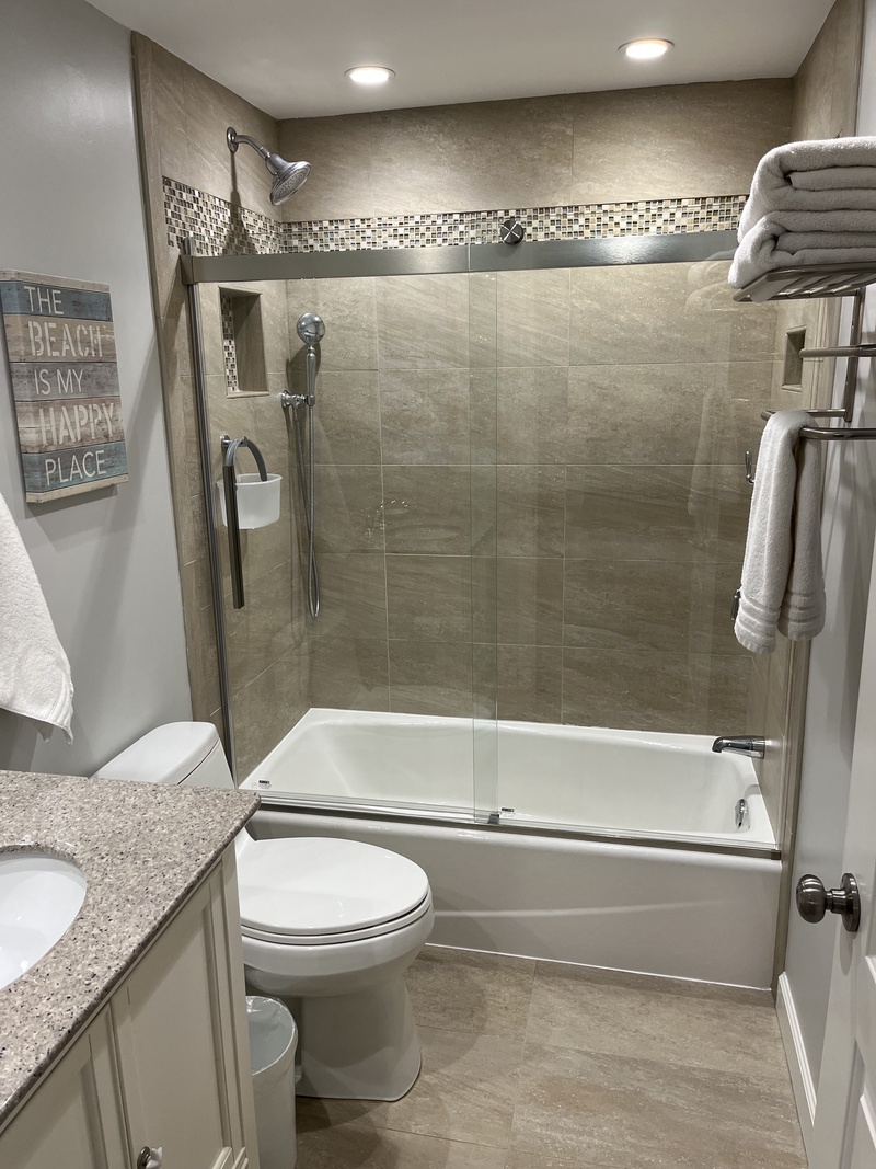 Step into your private sanctuary with elegant stone tiles, rainfall shower, and luxurious amenities—everything you need to refresh after exploring.