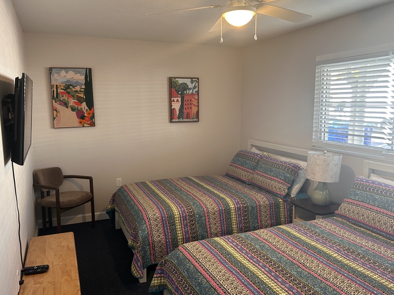 Rest peacefully in your comfortable twin beds with colorful bedding and charming artwork adorning the walls.