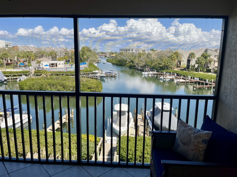 Your private balcony offers stunning waterfront views where you can relax with morning coffee while watching boats drift by on the peaceful canal.