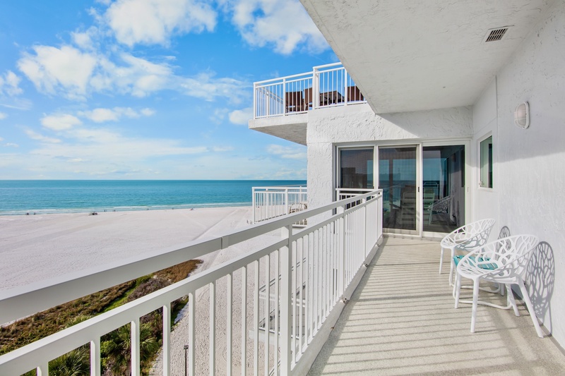 Soak in breathtaking ocean views from your private balcony, where white sands and turquoise waters stretch endlessly before you.