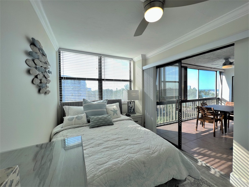 Wake up to stunning city views from your serene bedroom, where natural light flows through oversized windows and onto your private balcony.