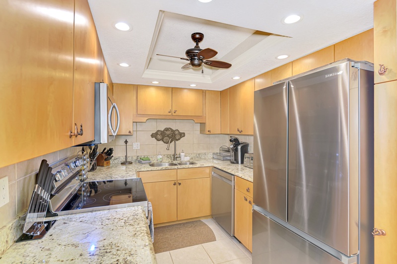 Your fully equipped kitchen awaits with granite countertops, stainless steel appliances, and everything you need to create delicious meals during your stay.