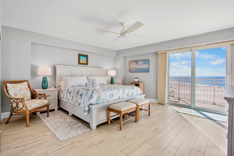 Wake up to stunning ocean views from your coastal-themed bedroom, where sea breeze flows through your private balcony doors.
