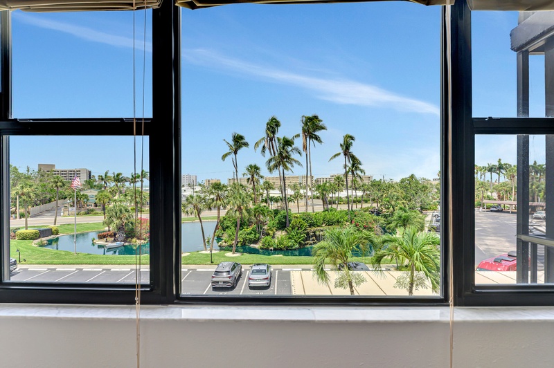 Wake up to stunning tropical views through your panoramic windows, where swaying palms and blue skies create your perfect paradise backdrop.