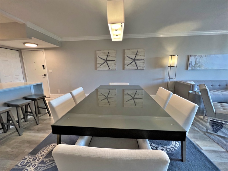 Gather around your sleek glass dining table with comfortable seating for six, perfect for memorable meals together.