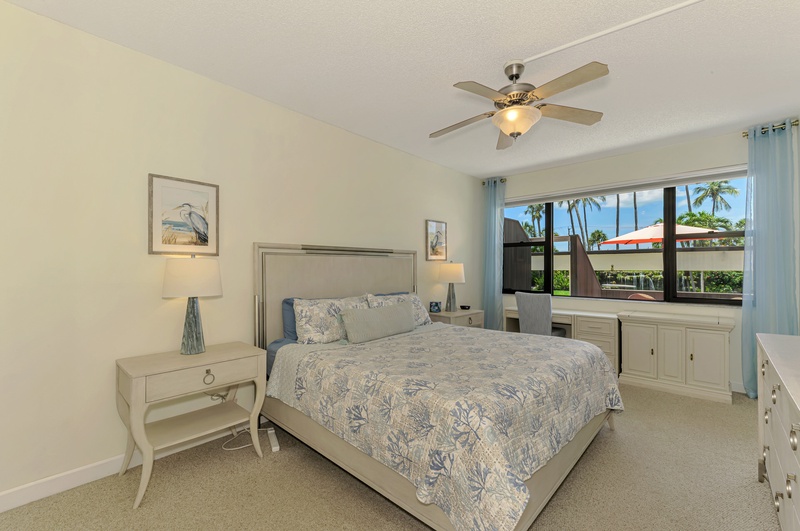 Wake up in your peaceful bedroom with tropical palm views and a gentle ceiling fan to keep you comfortable throughout the night.