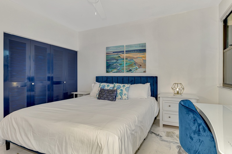 Drift off in your coastal-themed bedroom, where ocean blues and crisp whites create a serene sanctuary for restful nights.