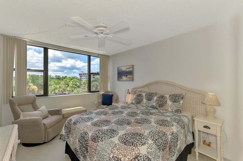 Drift off peacefully in your bright bedroom with garden views and gentle ceiling fan breeze.