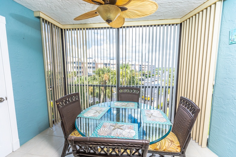 Enjoy your morning coffee on your private balcony, where tropical breezes and leafy palm views create the perfect backdrop for relaxation.