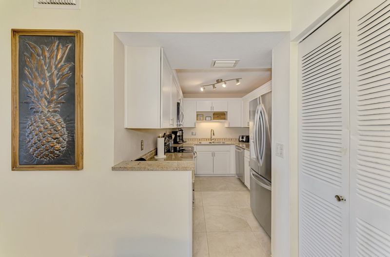 Your fully equipped kitchen features granite counters, stainless appliances, and everything needed to create memorable meals during your stay.