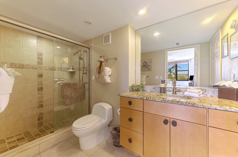 Step into your luxurious bathroom retreat with granite countertops, glass-enclosed shower, and premium finishes that create a spa-like sanctuary.