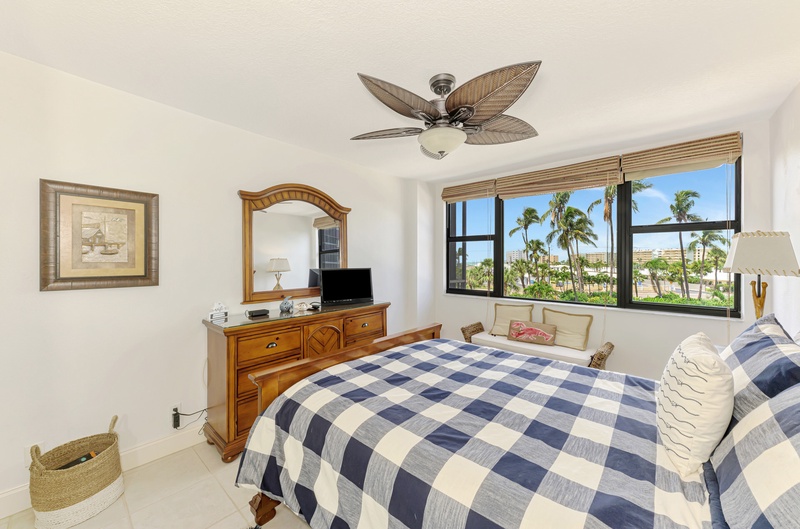 Drift off peacefully in your tropical bedroom with palm tree views and the gentle breeze from your ceiling fan creating the perfect island atmosphere.