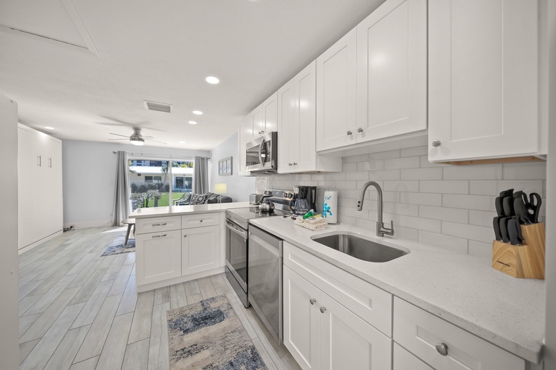Your fully equipped kitchen awaits with gleaming countertops, modern appliances, and everything you need to create memorable meals during your stay.