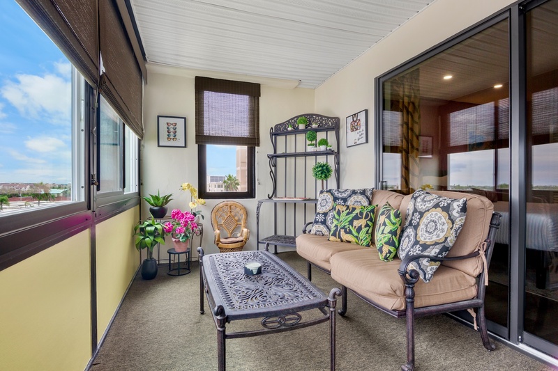 Screened outdoor space with lounge chairs