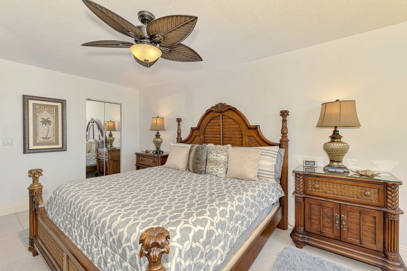 Drift into peaceful sleep in your elegantly appointed bedroom, where tropical-style furnishings and soft lighting create the perfect retreat.