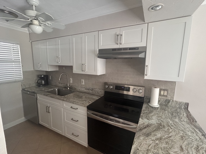 Your fully equipped kitchen features granite counters, modern appliances, and everything you need to create delicious meals during your stay.