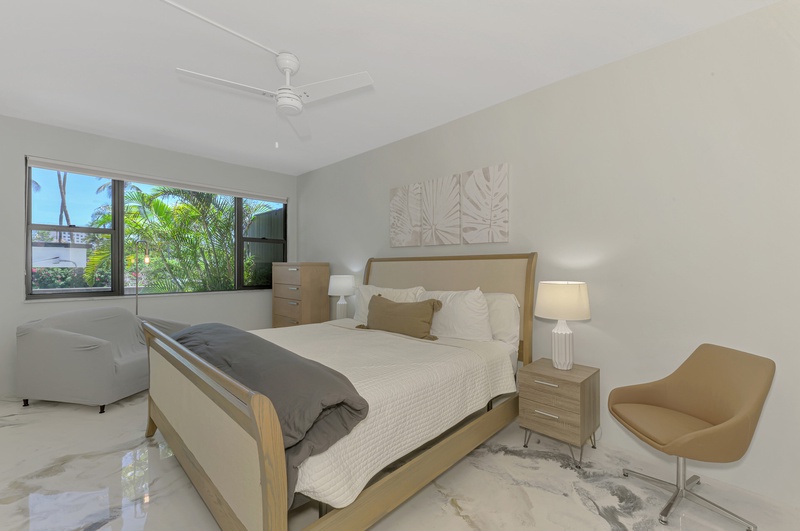 Drift off to sleep in your peaceful bedroom with garden views and modern comfort.