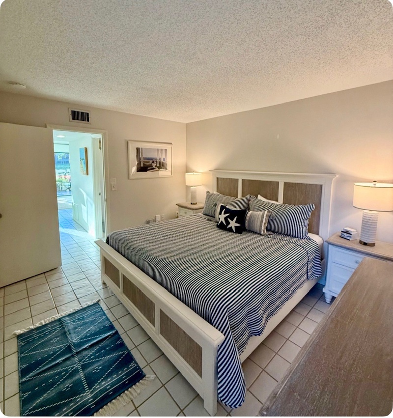 Sleep peacefully in your coastal bedroom with nautical touches and warm bedside lighting creating the perfect seaside retreat.