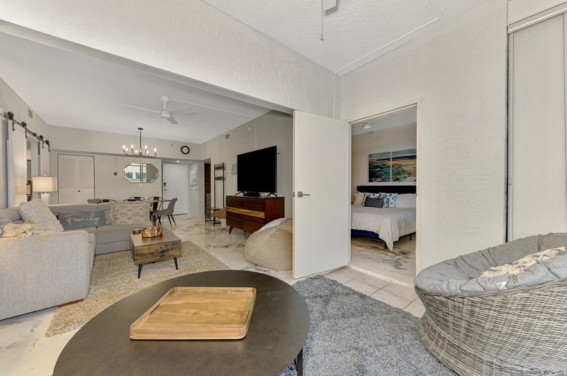 Relax in your open-plan living space with stylish furnishings, modern entertainment center, and seamless flow to your private bedroom sanctuary.