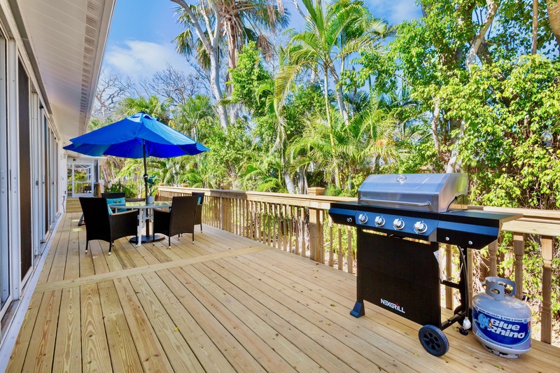 Outdoor dining area with BBQ grill