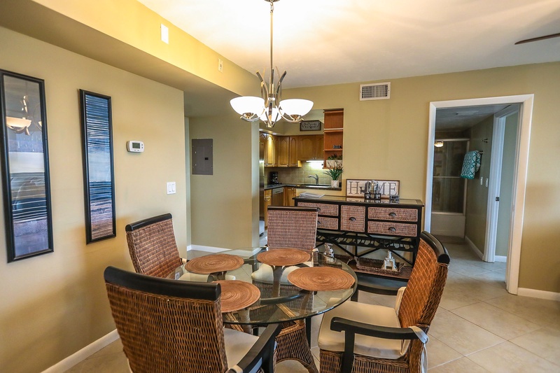 Gather around this elegant glass dining table where memorable meals await, perfectly positioned between your fully equipped kitchen and comfortable living space.