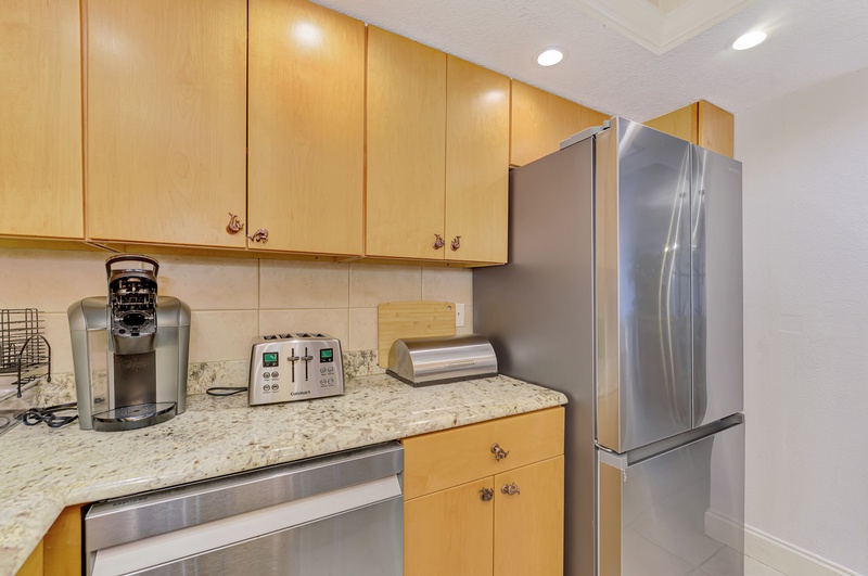 Your fully equipped kitchen features granite counters, stainless appliances, and everything you need for home-cooked meals during your stay.