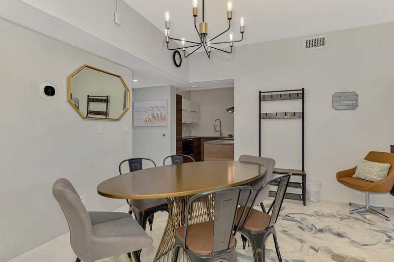 Gather around your stylish dining table for memorable meals, with modern pendant lighting creating perfect ambiance for intimate dinners.