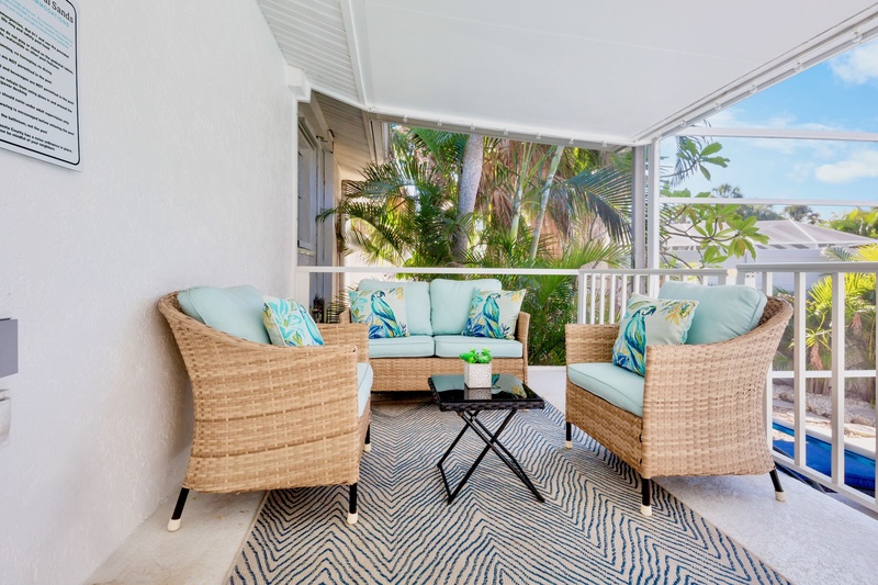 Relaxing screened lanai with seating
