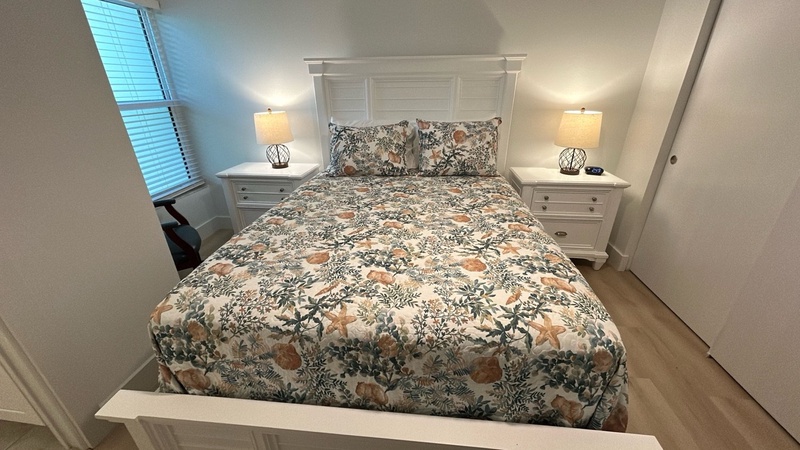 Drift into dreamland in your serene bedroom, complete with plush linens, warm bedside lighting, and calming floral patterns.