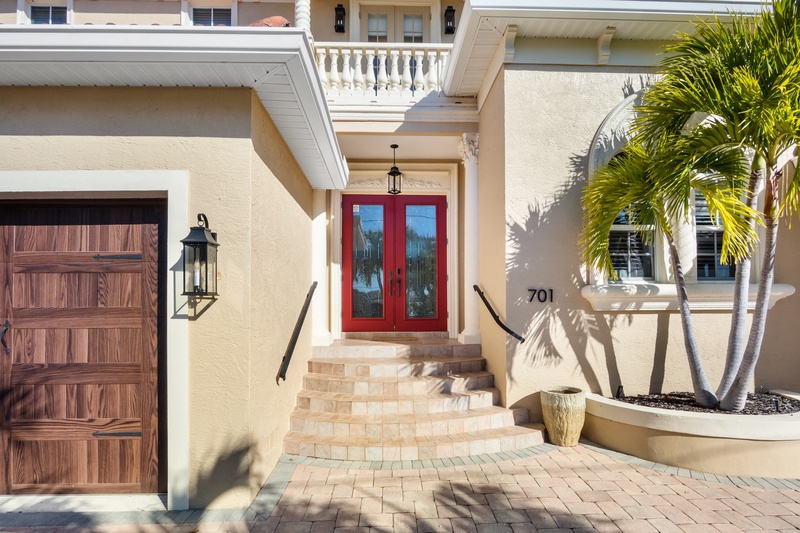 Welcoming entrance featuring striking red doors