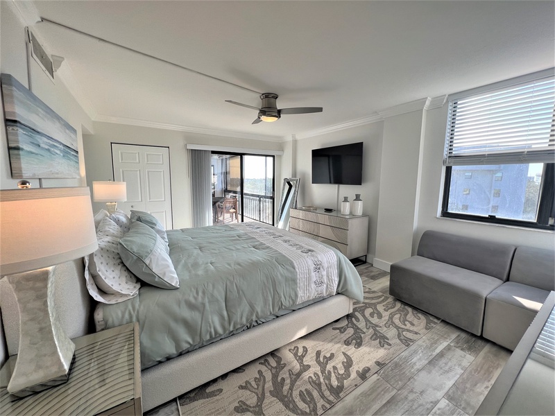 Unwind in this coastal-inspired bedroom where soft seafoam linens and ocean artwork create your perfect retreat.