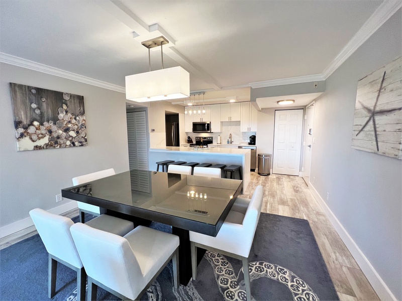 Gather around this sleek dining table where memorable meals and conversations await in your stylish modern space.