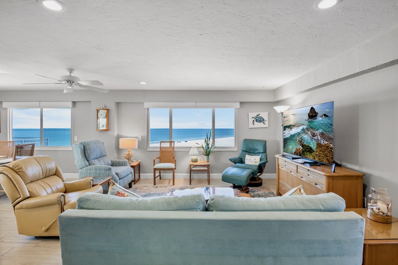 Unwind in this oceanfront living room where panoramic sea views create your perfect backdrop for relaxation and memorable moments.
