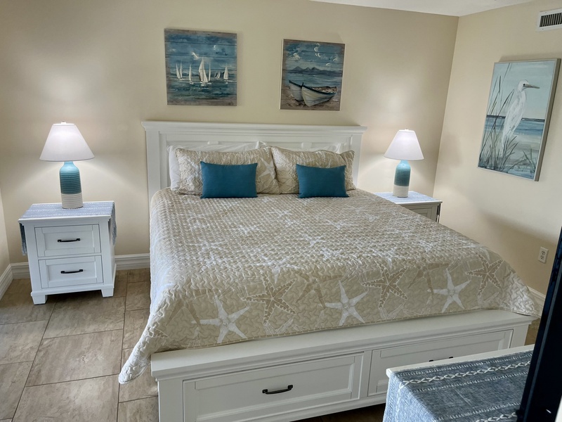 Drift off to peaceful dreams in your coastal-themed bedroom, where ocean artwork and soothing colors create your perfect seaside retreat.