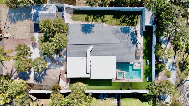 Aerial view of home with private pool and spa