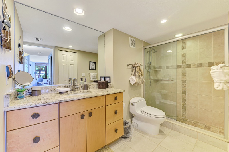 Unwind in your spacious bathroom featuring granite countertops, a luxurious walk-in shower, and thoughtful touches that make every morning feel special.