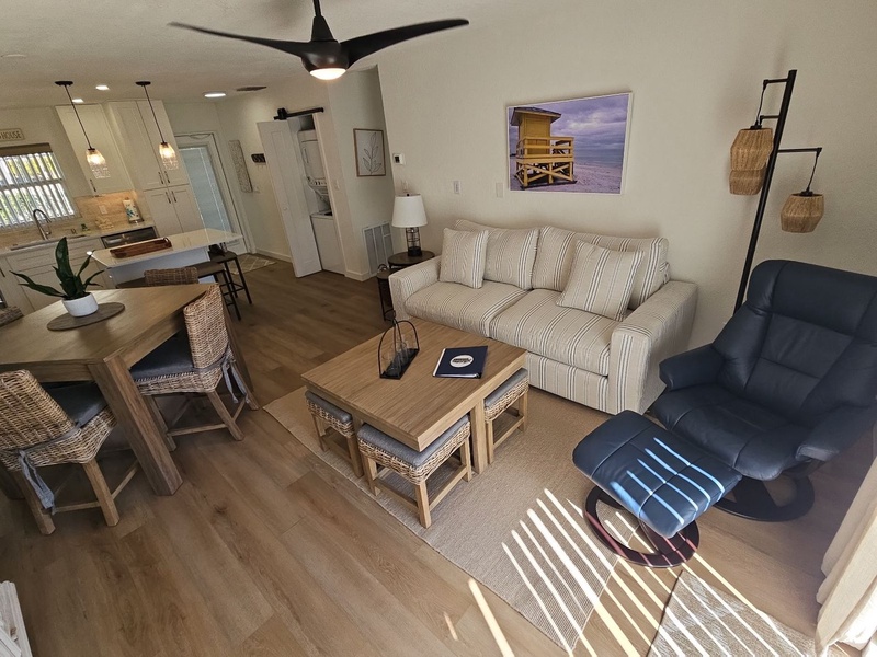 Relax in your bright, open living space with coastal touches and comfortable furnishings for memorable evenings together.