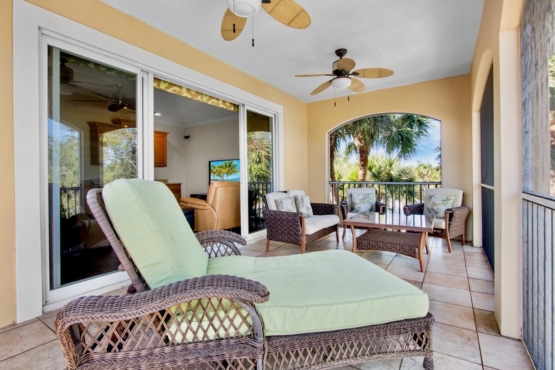 Private covered balcony with plush seating