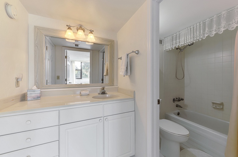 Refresh in your private bathroom with a full tub-shower combo, ample counter space, and bright vanity lighting.