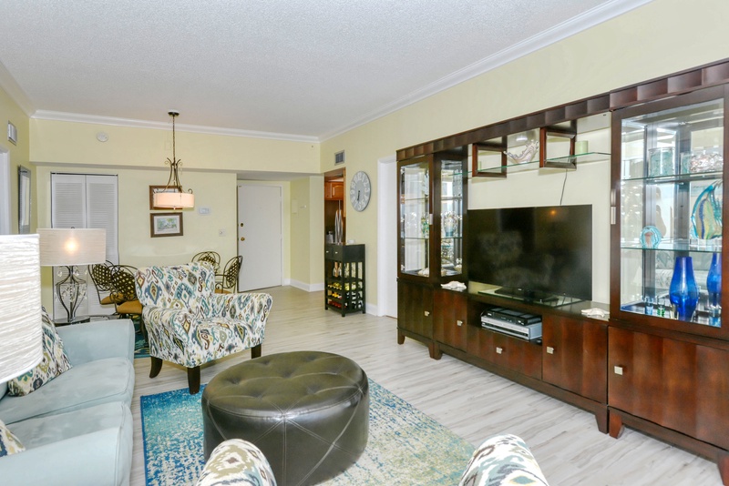 Relax in your stylish living space with elegant furniture, wall-mounted TV, and thoughtful lighting that creates the perfect atmosphere for unwinding.